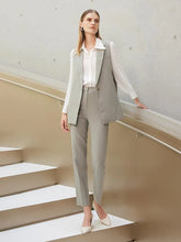 a woman in grey gilet